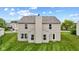 A two-story home displays a well-maintained lawn, neutral siding, and a prominent chimney for added architectural appeal at 5637 Woodland Trace Blvd, Indianapolis, IN 46237