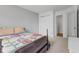 Bedroom with a bed, closet, and doorway for storage and comfort at 5637 Woodland Trace Blvd, Indianapolis, IN 46237