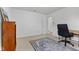 Bright bedroom featuring an office setup, complete with a desk, bookshelf and blue rug at 5637 Woodland Trace Blvd, Indianapolis, IN 46237