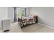 Bright bedroom with a window and a comfortable bed and stylish decor at 5637 Woodland Trace Blvd, Indianapolis, IN 46237