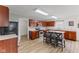 Functional kitchen with wood cabinetry, stainless steel appliances, and an island breakfast bar at 5637 Woodland Trace Blvd, Indianapolis, IN 46237
