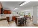 Eat-in kitchen features wood cabinetry, stainless steel appliances, and a peninsula with seating at 5637 Woodland Trace Blvd, Indianapolis, IN 46237