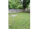 Spacious backyard featuring a wooden fence and lush green grass, perfect for outdoor activities at 5938 Price Ln, Indianapolis, IN 46254