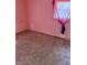 This bedroom has carpet and is painted with pink walls at 5938 Price Ln, Indianapolis, IN 46254