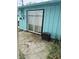 View of a sliding glass door leading to a concrete patio area on the exterior of the home at 5938 Price Ln, Indianapolis, IN 46254