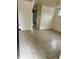 An empty living room with tile flooring and a view into an adjacent space at 5938 Price Ln, Indianapolis, IN 46254