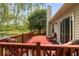 A peaceful backyard featuring a wooden deck and a pond at 5967 Peregrine Blvd, Indianapolis, IN 46228