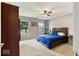 The bedroom features two windows, a ceiling fan, and carpeted floors at 5967 Peregrine Blvd, Indianapolis, IN 46228