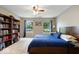 The bedroom has windows, curtains, and carpeted floors at 5967 Peregrine Blvd, Indianapolis, IN 46228