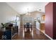 The dining room features hardwood floors, a chandelier, and large windows at 5967 Peregrine Blvd, Indianapolis, IN 46228