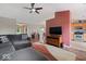 Open-concept living area with hardwood floors, neutral colors, a ceiling fan, and a view of the kitchen at 5967 Peregrine Blvd, Indianapolis, IN 46228