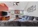 Bright living room with hardwood floors, cozy couch and a fireplace at 5967 Peregrine Blvd, Indianapolis, IN 46228