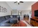 Spacious living room featuring a cozy couch, hardwood floors, and a neutral color scheme at 5967 Peregrine Blvd, Indianapolis, IN 46228