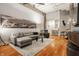 Contemporary living room with comfortable seating, hardwood floors, and high ceilings at 611 N Park Ave # 104, Indianapolis, IN 46204
