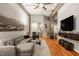 Open-concept living room with hardwood floors, modern furniture, and plenty of natural light at 611 N Park Ave # 104, Indianapolis, IN 46204