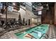 Indoor pool area with workout equipment, brick walls and exposed pipes giving an industrial-chic style at 611 N Park Ave # 104, Indianapolis, IN 46204