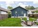 Backyard features a fire pit with chairs, perfect for relaxing outdoors at 614 N Drexel Ave, Indianapolis, IN 46201