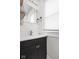Well-lit bathroom featuring a modern vanity, bright mirror, and classic fixtures at 614 N Drexel Ave, Indianapolis, IN 46201