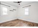 Inviting bedroom features hardwood floors and classic windows at 614 N Drexel Ave, Indianapolis, IN 46201