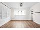 Bright dining room with built-in cabinets, wood floors and recessed lighting at 614 N Drexel Ave, Indianapolis, IN 46201