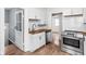 Modern kitchen featuring stainless steel appliances, white cabinets, and wood countertops at 614 N Drexel Ave, Indianapolis, IN 46201