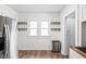 Bright eat-in kitchen featuring stainless steel appliances and wood-look flooring at 614 N Drexel Ave, Indianapolis, IN 46201