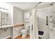 Accessible bathroom featuring handrails, a shower seat, and safety features at 6308 Ratliff Rd, Indianapolis, IN 46113