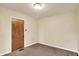 Bedroom featuring a ceiling light, brown carpet, and cream colored walls at 6308 Ratliff Rd, Indianapolis, IN 46113