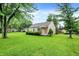 Beautiful home with large front yard and mature trees offering plenty of shade at 6308 Ratliff Rd, Indianapolis, IN 46113