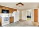 Kitchen boasting wooden cabinets, white appliances, and durable tile flooring at 6308 Ratliff Rd, Indianapolis, IN 46113