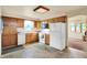 Bright kitchen with wooden cabinets and white appliances, offering a functional layout at 6308 Ratliff Rd, Indianapolis, IN 46113