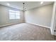 Large bedroom with neutral carpeting, recessed lighting, and a window with natural light at 6350 Stallion Way, Indianapolis, IN 46260
