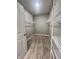 Walk-in closet features shelving and neutral carpeting at 6350 Stallion Way, Indianapolis, IN 46260