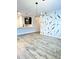Open concept living space with luxury vinyl plank flooring at 6350 Stallion Way, Indianapolis, IN 46260