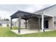 Enjoy this cozy covered patio area, perfect for relaxing outdoors in the beautiful backyard at 6350 Stallion Way, Indianapolis, IN 46260