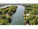 Breathtaking aerial view of a serene lake surrounded by dense forests and waterfront properties at 6492 Osprey Dr, Nineveh, IN 46164