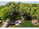 Scenic aerial view showcases the home nestled among lush trees near the calm lake at 6492 Osprey Dr, Nineveh, IN 46164
