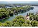 Breathtaking aerial view of a lake community nestled among lush trees, showcasing lakefront properties at 6492 Osprey Dr, Nineveh, IN 46164