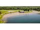 Stunning aerial view of a pristine beach with clear water and sandy shorelines at 6492 Osprey Dr, Nineveh, IN 46164
