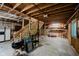Unfinished basement space with exposed ceiling and open floor plan at 6492 Osprey Dr, Nineveh, IN 46164