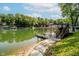 Well-maintained wooden boat dock featuring stairs into the water, providing easy access for swimming and boating at 6492 Osprey Dr, Nineveh, IN 46164