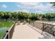 Scenic lake view from a private wooden dock with metal railings, perfect for relaxing or fishing at 6492 Osprey Dr, Nineveh, IN 46164