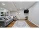 Living room with neutral colors, LVP floors, and a large sectional sofa at 6492 Osprey Dr, Nineveh, IN 46164