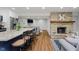 Open concept kitchen and living room with a stone fireplace and stainless steel appliances at 6492 Osprey Dr, Nineveh, IN 46164