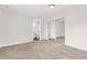 Cozy bedroom with plush carpeting, a mirrored closet, and a doorway to a private bathroom at 6853 Kellum Dr, Indianapolis, IN 46221
