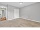 Well-lit carpeted bedroom features a double door closet and neutral paint at 6853 Kellum Dr, Indianapolis, IN 46221