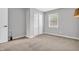 Bright bedroom with a window, carpet and closet for ample storage at 6853 Kellum Dr, Indianapolis, IN 46221