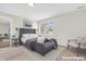 Comfortable main bedroom with a large window, neutral tones, and elegant decor, virtually staged at 6853 Kellum Dr, Indianapolis, IN 46221