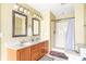 A bright bathroom featuring a double sink vanity and a walk-in shower at 7082 Hunters Ridge Dr, Plainfield, IN 46168