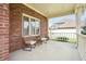 Relaxing covered front porch with views of the surrounding neighborhood at 7082 Hunters Ridge Dr, Plainfield, IN 46168